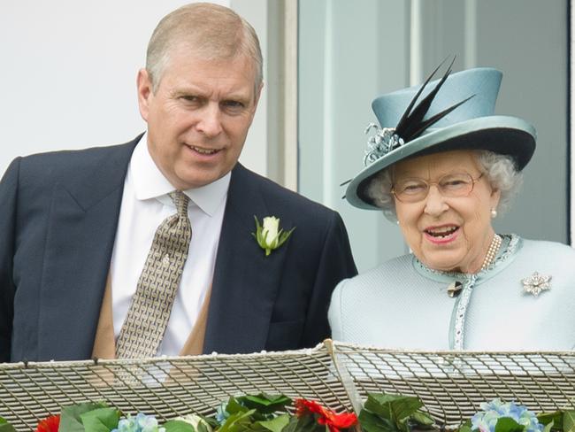 Prince Andrew, the Duke of York (L) speaks to Queen Elizabeth II. Picture: AFP