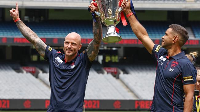 MELBOURNE.  05/12/2021.  AFL. Melbourne Premiership celebrations at the MCG..   Nathan Jones and Neville Jetta with the cup     ...  Photo by Michael Klein.