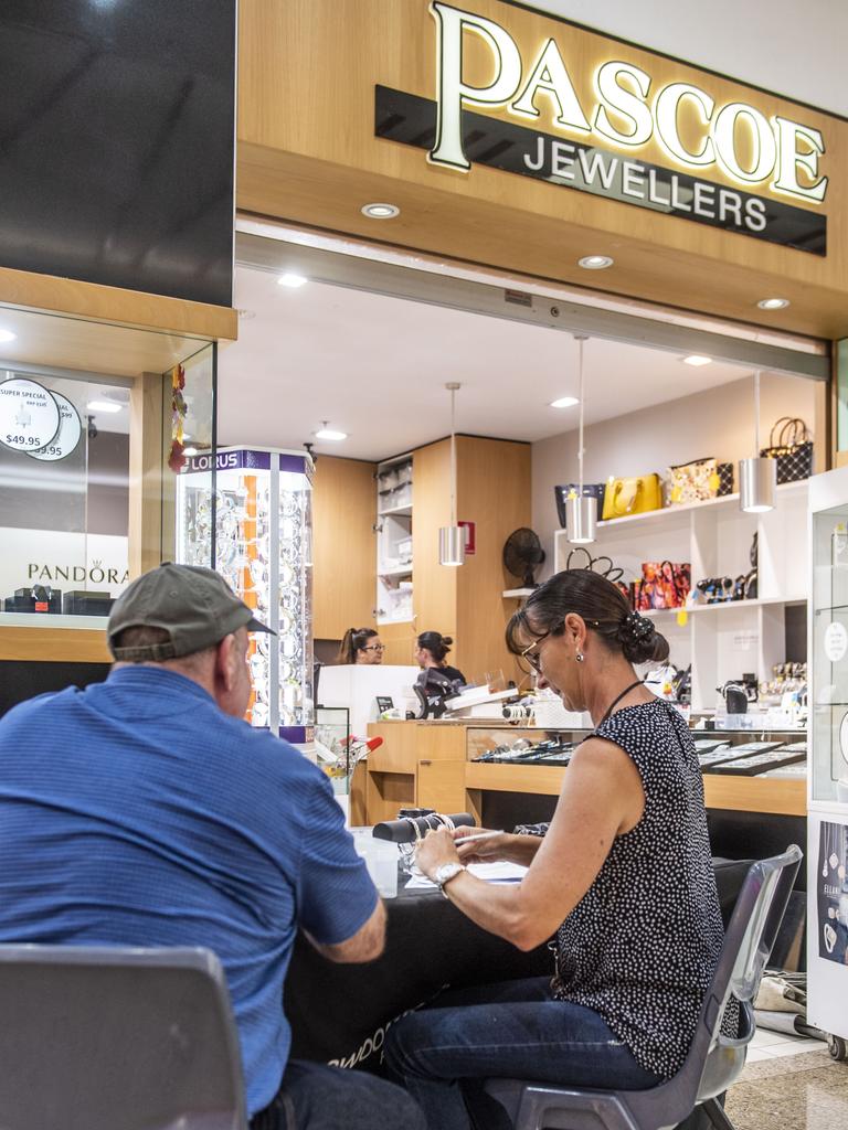 Staff take stocktake following an early morning smash and grab at Pascoe Jewellers in the Toowoomba Plaza. Photo: Nev Madsen.