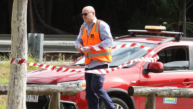 A council worker erects signs warning people of the magpie following the attack. Picture: Liam Kidston