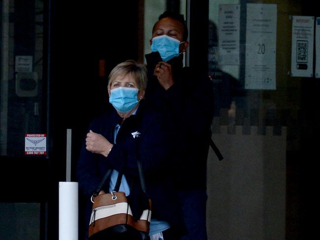 Health staff at the Melbourne Airport Holiday Inn, site of the latest outbreak. Picture: Andrew Henshaw