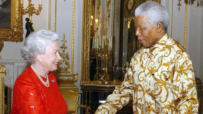 Queen Elizabeth with former South African President Nelson Mandela during a reception at Buckingham Palace in London in 1982. Picture: AFP.