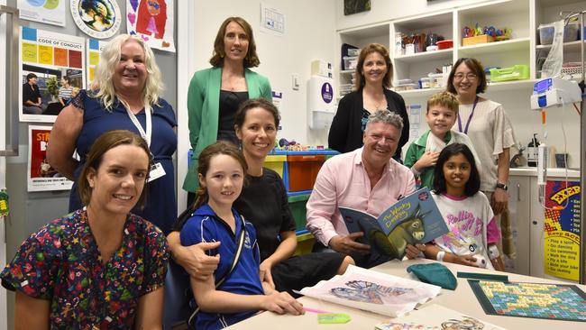 Royal Darwin Hospital school teacher Ruth Furbey, nursing director of operations division of women, children, and youth Sara Harn, Education Minister Mark Monaghan with staff and families. Picture: Sierra Haigh