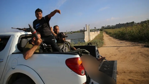 The body of Israeli hostage Shani Louk being paraded on the back of a pickup truck by Palestinian terrorists. Picture: Supplied