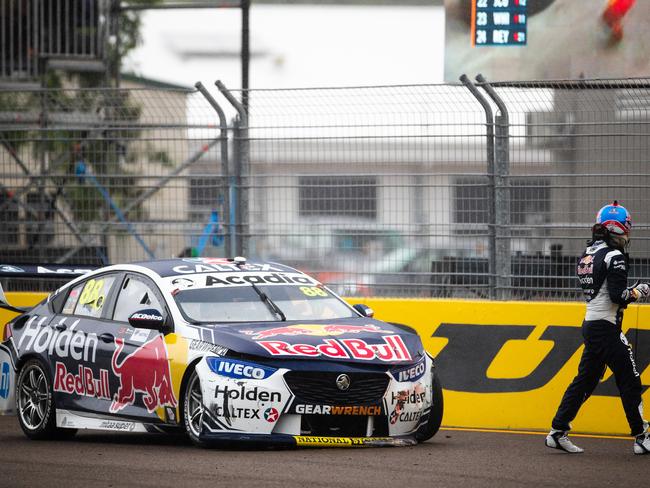 TOWNSVILLE, AUSTRALIA - JULY 07: (EDITORS NOTE: A polarizing filter was used for this image.) Jamie Whincup driver of the #88 Red Bull Holden Racing Team Holden Commodore ZB walks from his car after crashing during race 2 on July 07, 2019 in Townsville, Australia. (Photo by Daniel Kalisz/Getty Images)