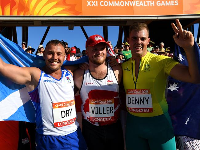 Matty Denny after winning silver in the hammer throw at the 2016 Gold Coast Commonwealth Games, with gold medallist Matt Dry of Scotland, and bronze medallist Nick Miller of England. Denny finished fourth in the discus throw at the same Games. Picture: AAP Image