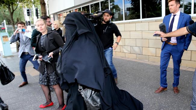 A woman believed to be one of the boys’ parents leaves the Parramatta children's court after a short bail hearing. Picture: John Grainger