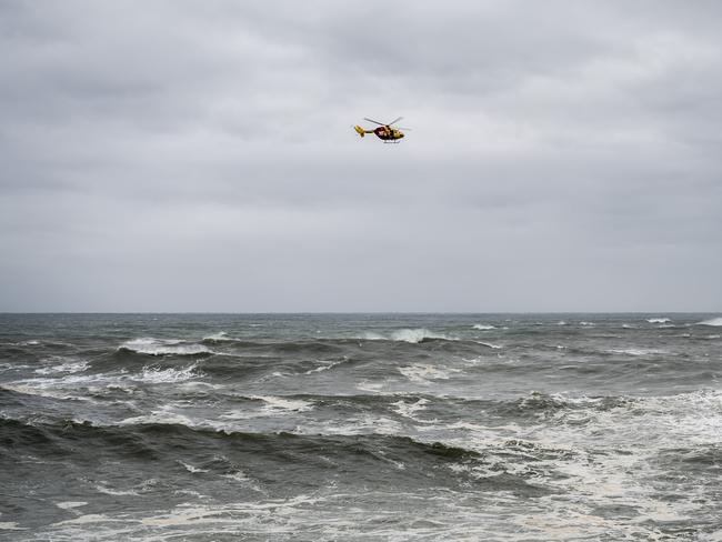 A number of helicopters were searching the coast for anyone who may have been thrown into the sea when a boat capsized off Bronte. Picture: Darren Leigh Roberts