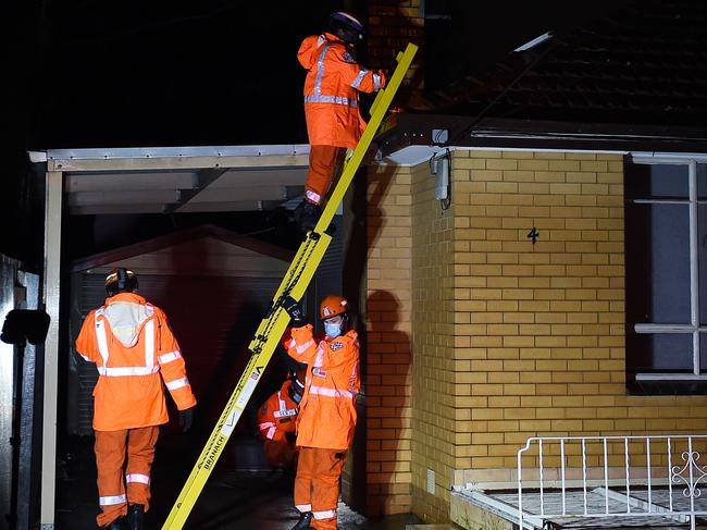 SES clearing the debris from a veranda that blew up onto the roof of this house in Woorite Place, Keilor East. Picture: Josie Hayden