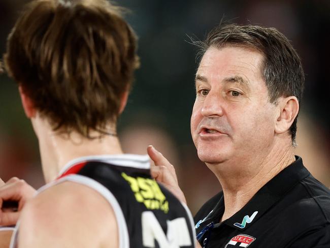 MELBOURNE, AUSTRALIA - JULY 30: Ross Lyon, Senior Coach of the Saints speaks with Mattaes Phillipou of the Saints during the 2023 AFL Round 20 match between the Hawthorn Hawks and the St Kilda Saints at Marvel Stadium on July 30, 2023 in Melbourne, Australia. (Photo by Michael Willson/AFL Photos via Getty Images)