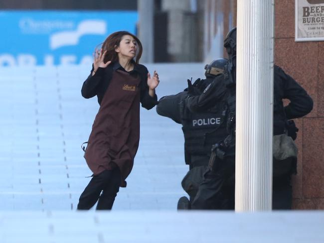 Elly Chen escapes from the Lindt Cafe in Martin Place. Picture: Adam Taylor