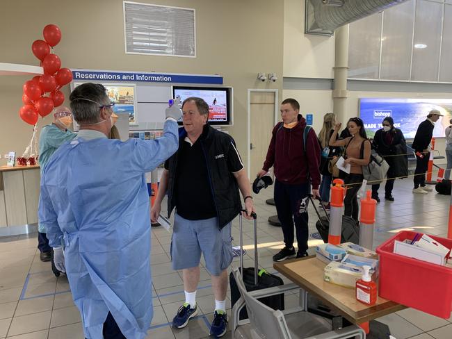 Jetstar passengers having their body temperature checked by NSW Health at Ballina Byron Gateway Airport on July 3.