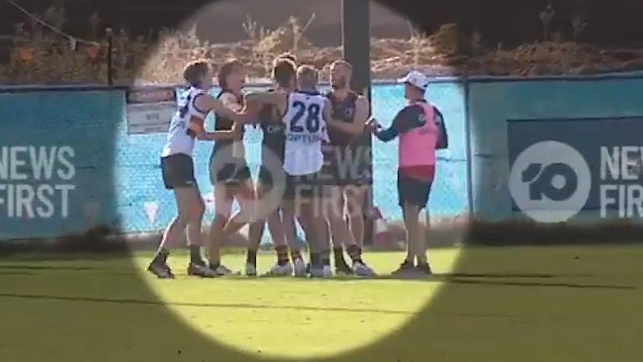 Adelaide teammates throw fists at training.