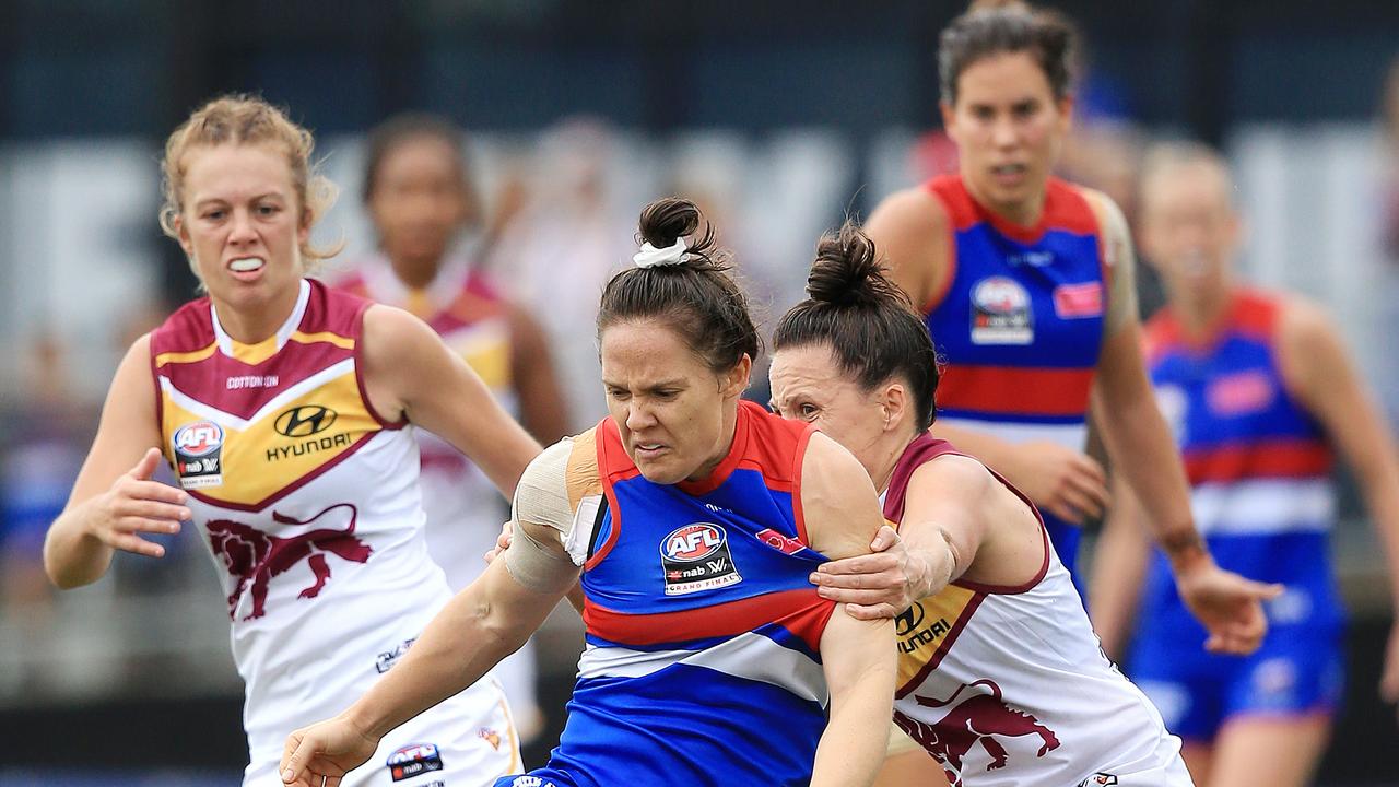 Emma Kearney (front) and Libby Birch (back right) were heavily involved in the wet weather clash that was played mostly between the arcs to halftime. Picture: Mark Stewart