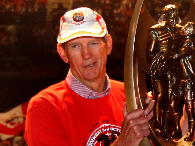 Coach Wayne Bennett (L) and captain Ben Hornby show off the Telstra Premiership trophy to the fans packing the WIN Entertainment Centre in Wollongong to celebrate victory with players day after St George-Illawarra Dragons defeated Sydney Roosters in 2010 NRL Grand Final.