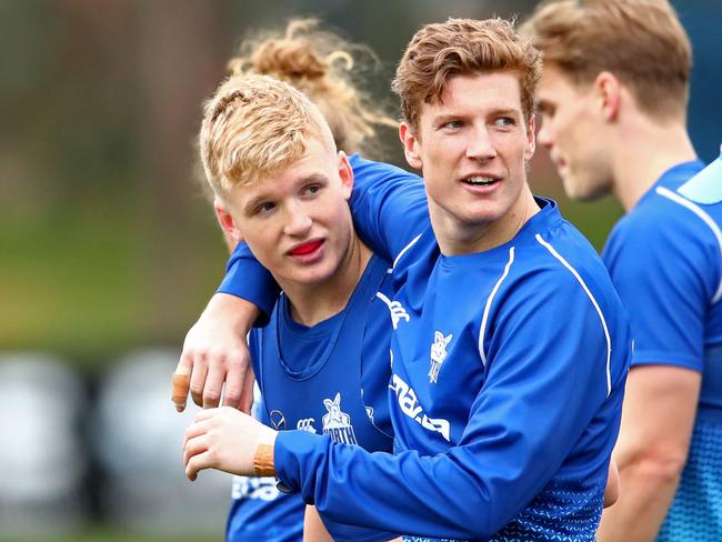 Red Og Murphy and Lachlan Hosie look on during a North Melbourne Kangaroos training session at Arden Street Oval, North Melbourne, Wednesday, August 7, 2019. (AAP Image/Scott Barbour) NO ARCHIVING