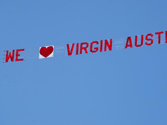 Virgin Australia sign being flown over Queenscliff.picture: Glenn Ferguson