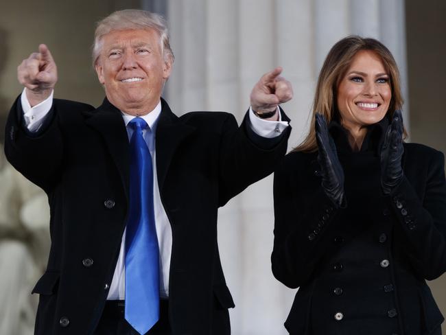 President-elect Donald Trump, left, and his wife Melania Trump arrive to the "Make America Great Again Welcome Concert" at the Lincoln Memorial, Thursday, Jan. 19, 2017, in Washington. (AP Photo/Evan Vucci)