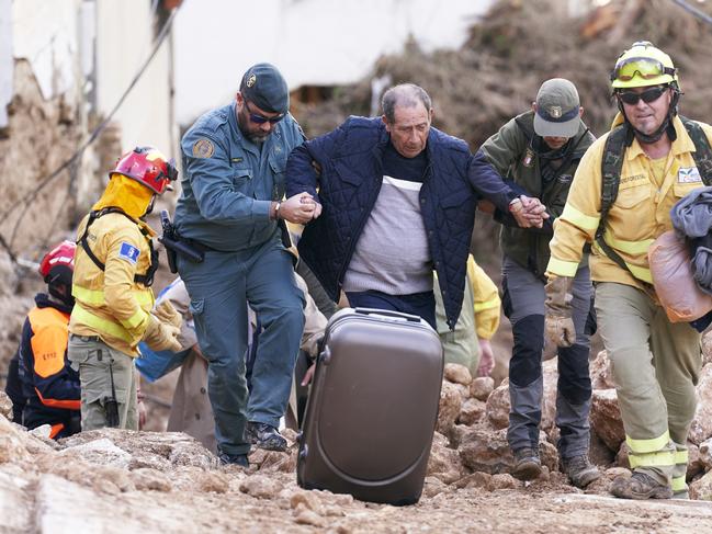 Emergency workers rescue a man in Letur, Albacete province. Picture: Getty Images