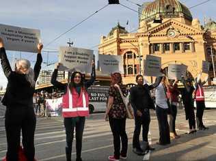 REALLY? Animal rights protesters block the intersections of Flinders and Swanston Street during early morning traffic in Melbourne, Monday, April 8, 2019. Picture: DAVID CROSLING