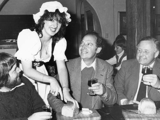 Lunch at The Barn at McLaren Vale during Wine Bushing Festival in 1979. Vicki Bennett serves John Williamson, David Hardy and Tony Lucas