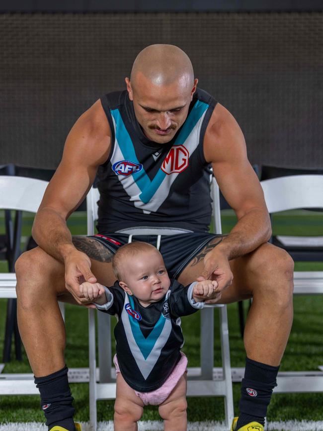 Sam Powell-Pepper with his daughter at the Port team photo day. Picture: Ben Clark