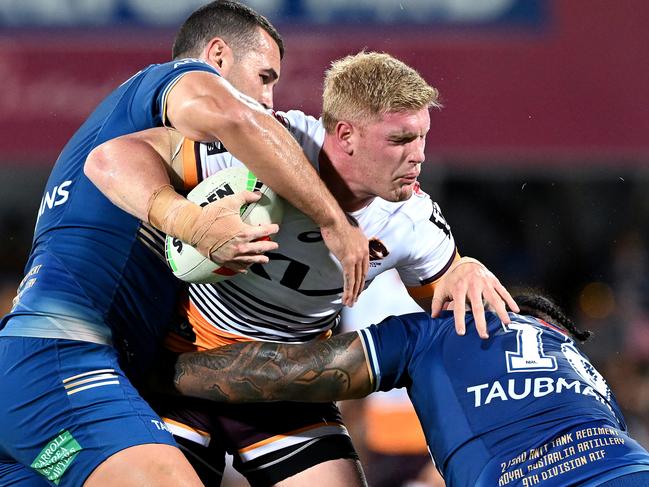 DARWIN, AUSTRALIA - APRIL 21: Tom Flegler of the Broncos is tackled during the round eight NRL match between Parramatta Eels and Brisbane Broncos at TIO Stadium on April 21, 2023 in Darwin, Australia. (Photo by Bradley Kanaris/Getty Images)