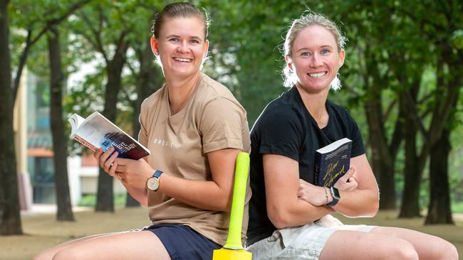 T20 Cricketers Beth Mooney & Jess Jonassen catching up on their reading.Picture Jay Town