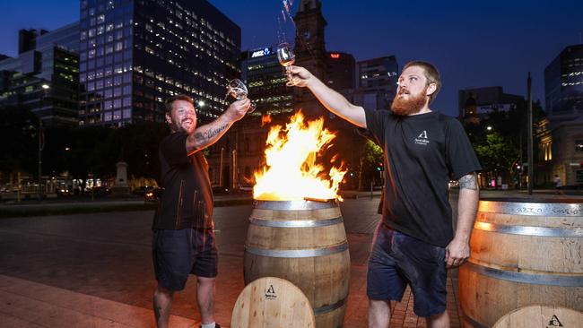 Shaun Ilott and Scott Evans of Master Cask toast to barrel casking ahead of their live demonstration in Town Square for Tasting Australia. Picture: Russell Millard