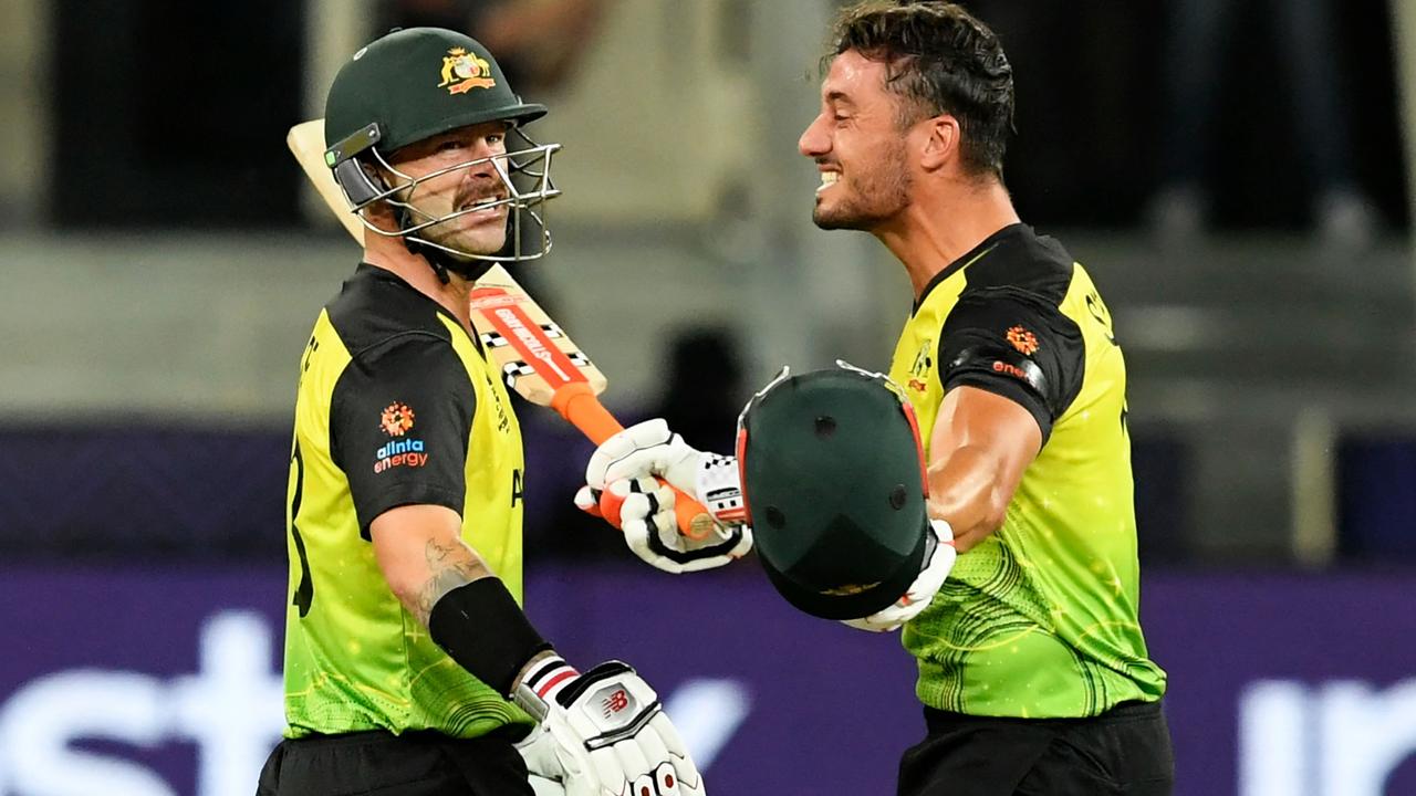 Marcus Stoinis (R) and Matthew Wade celebrate their victory as Australia progressed through to the World Cup final. Photo: AFP