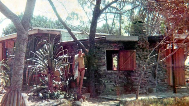 Miles Sewell looks through family photographs of his dad, Johns, time on Old Woman Island.Licence for publication only in The Sunshine Coast Daily. Picture: Contributed