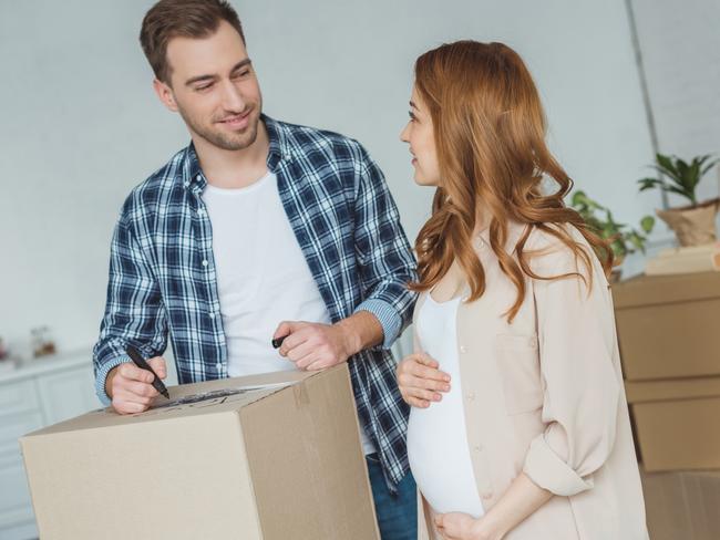 pregnant woman and husband at new apartment, relocation concept. iStock image. For Herald Sun Realestate sponsored content for Park Ave 22SEP18