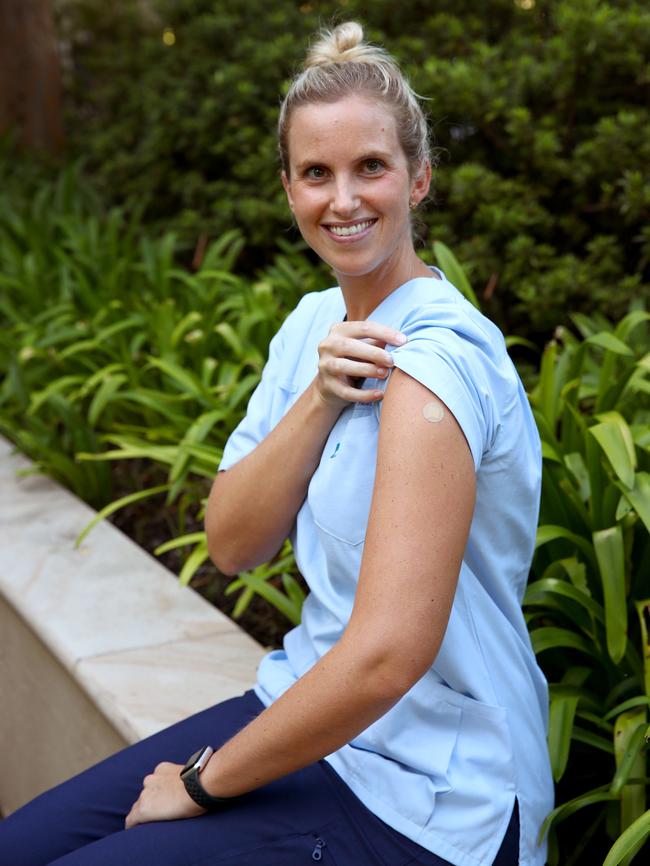 Thousands of frontline health workers in NSW, including NSW acting airport nurse manager Sarah Keast have already received their first dose of Pfizer. Picture: Toby Zerna