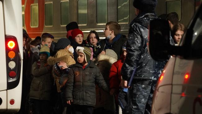 Ukrainian children prepare to board a bus in Taganrog to be evacuated deep into Russiae. Picture: AFP