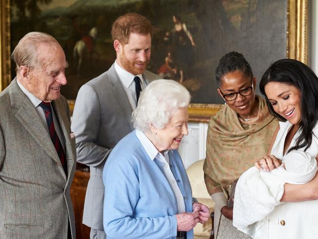 Archie meets the Royal Firm, but the Queen reportedly won’t be able to attend his christening. Picture: Getty