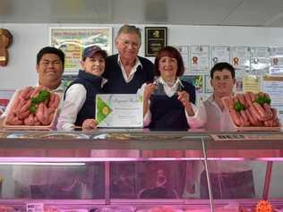 SAUSAGE ROYALTY: Miles Wholesale Meats and Smallgoods staff: school-based Max Andrews, apprentice Jess Eland, owners Daryl and Lyn Bein, and butcher Matt Tong. Picture: Brooke Duncan