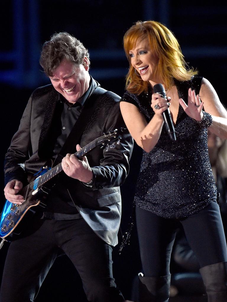 Reba McEntire (R) performs onstage during the 50th Academy Of Country Music Awards 2015 in Texas. Picture: Getty