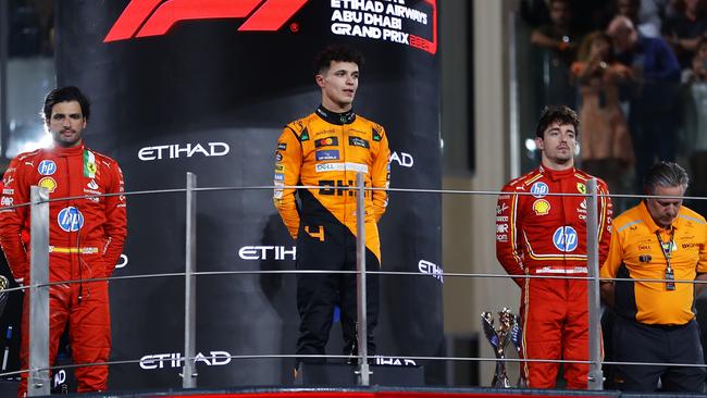 Lando Norris is flanked by the Ferrari drivers on the real podium in Abu Dhabi. (Photo by Joe Portlock/Getty Images)