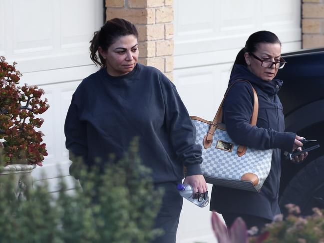 Natasha Moradian, left, seen with family and friends at a house in Fairfield West after the shooting of her estranged husband Alen Moradian. Image courtesy Daily Mail Australia/Matrix