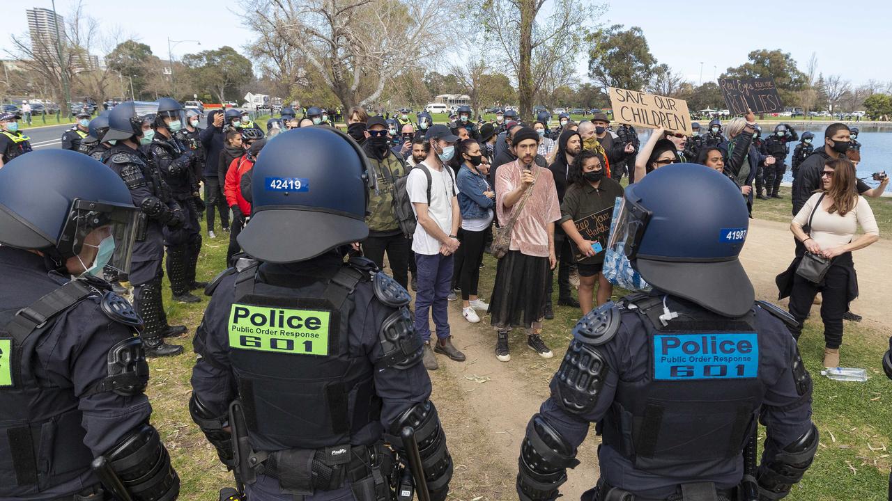 Police contain protesters at Albert Park Lake in Melbourne. Picture: NCA NewsWire / Daniel Pockett