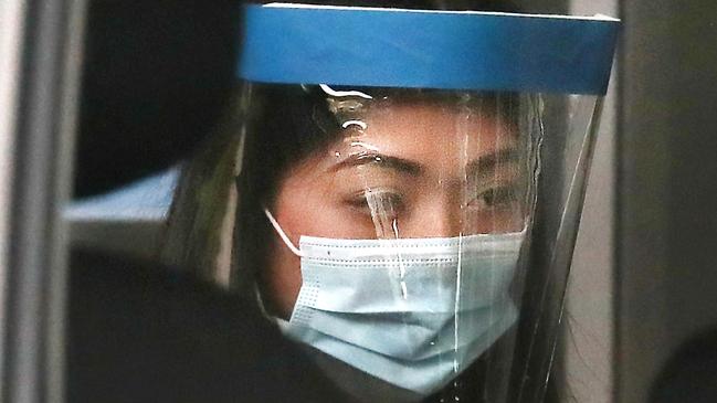 Sarah Caisip about to see her dad for the last time after his funeral at the Mt Gravatt Cemetery. Picture: Annette Dew