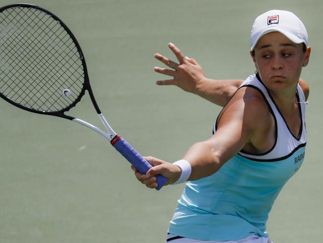 Ashleigh Barty, of Australia, returns to Anett Kontaveit, of Estonia, during the quarterfinals the Western & Southern Open tennis tournament, Thursday, Aug. 15, 2019, in Mason, Ohio. (AP Photo/John Minchillo)