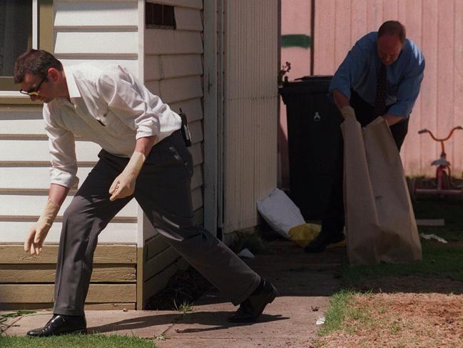 Police conduct a search at the scene of the shooting. File picture