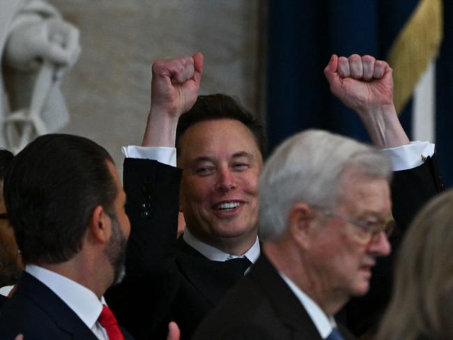 Tesla CEO Elon Musk reacts as newly sworn-in President Donald Trump speaks during the 60th inaugural ceremony. Picture: AFP