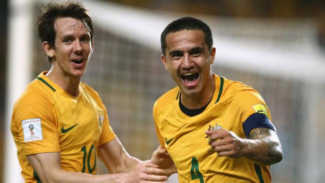 Robbie Kruse and Tim Cahill of Australia celebrate.