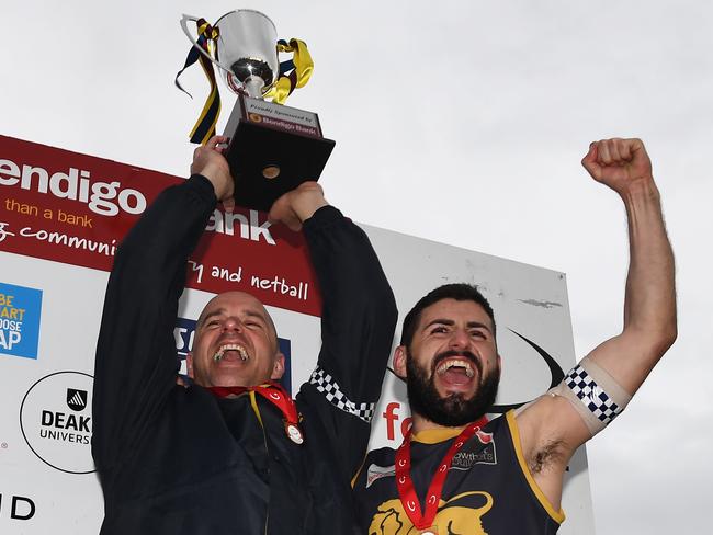 Steve Buckle and Nick Batsanis show off last year’s silverware. Picture: James Ross/AAP