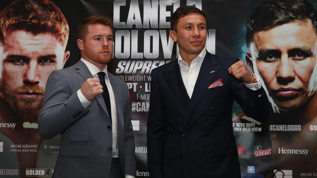 Canelo Alvarez and Gennady Golovkin pose up.