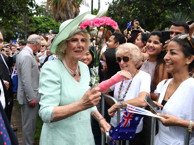 The Duchess of Cornwall receives flowers from a member of the public during a visit to Brisbane. Picture: Dan Peled/AAP