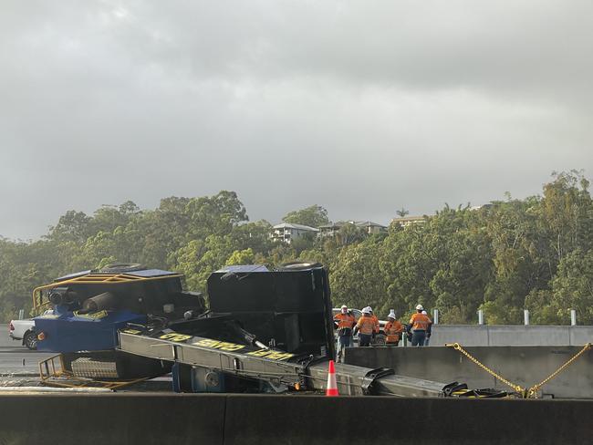 A crane which tipped over, blocking a lane of the M1 at Burleigh Heads on the Gold Coast on Monday, February 13, 2023. Picture: Sam Stolz