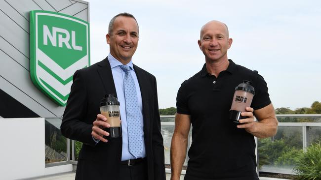 Adam MacDougall, right, with NRL chief executive Andrew Abdo.